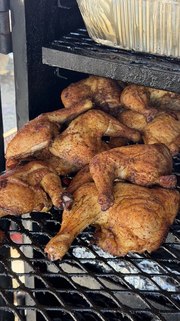 Chicken smoking in the pit